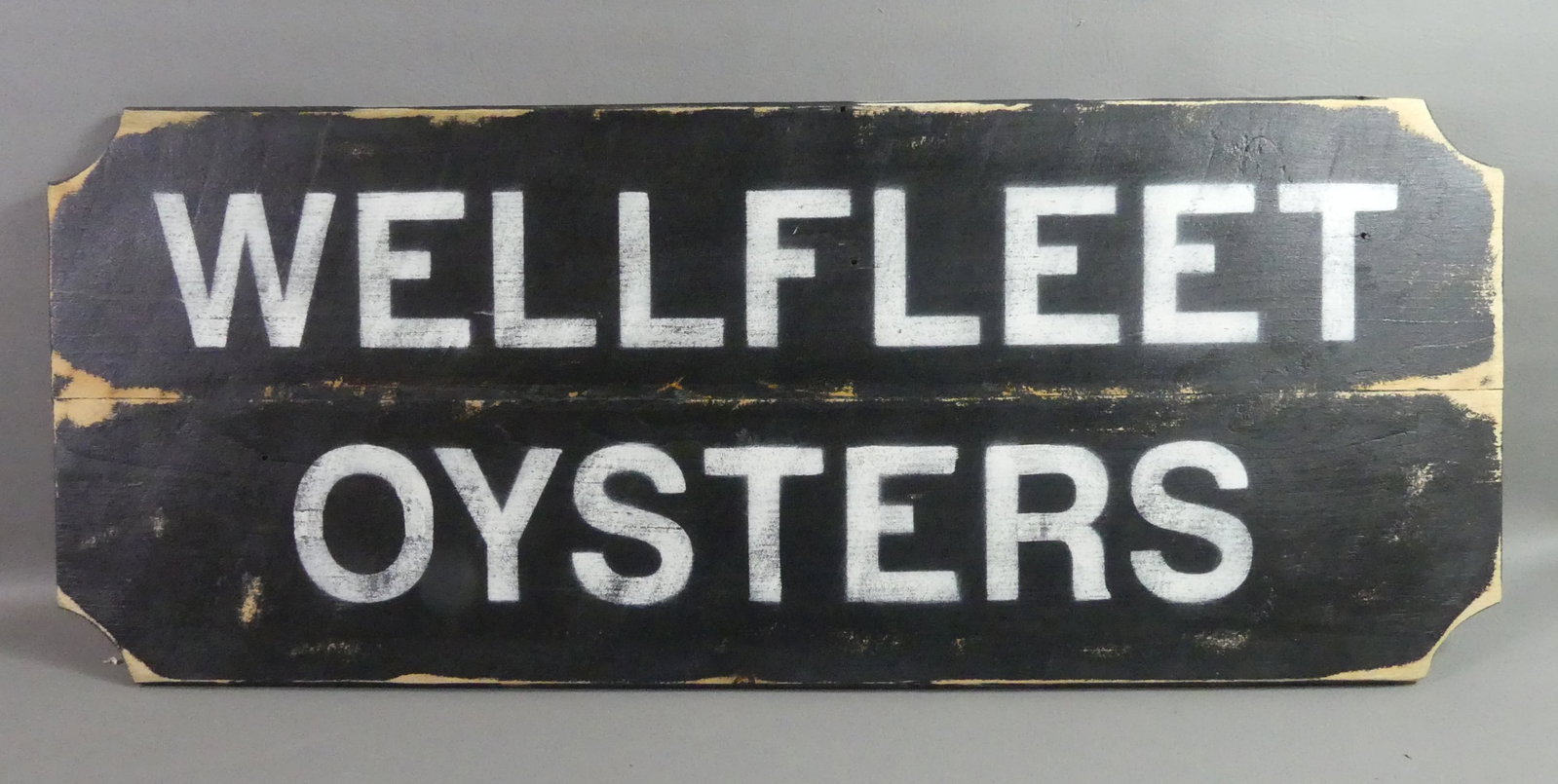 WELLFLEET OYSTERS SIGN: Wooden stencilled sign WELLFLEET OYSTERS. 15 X 38 in.