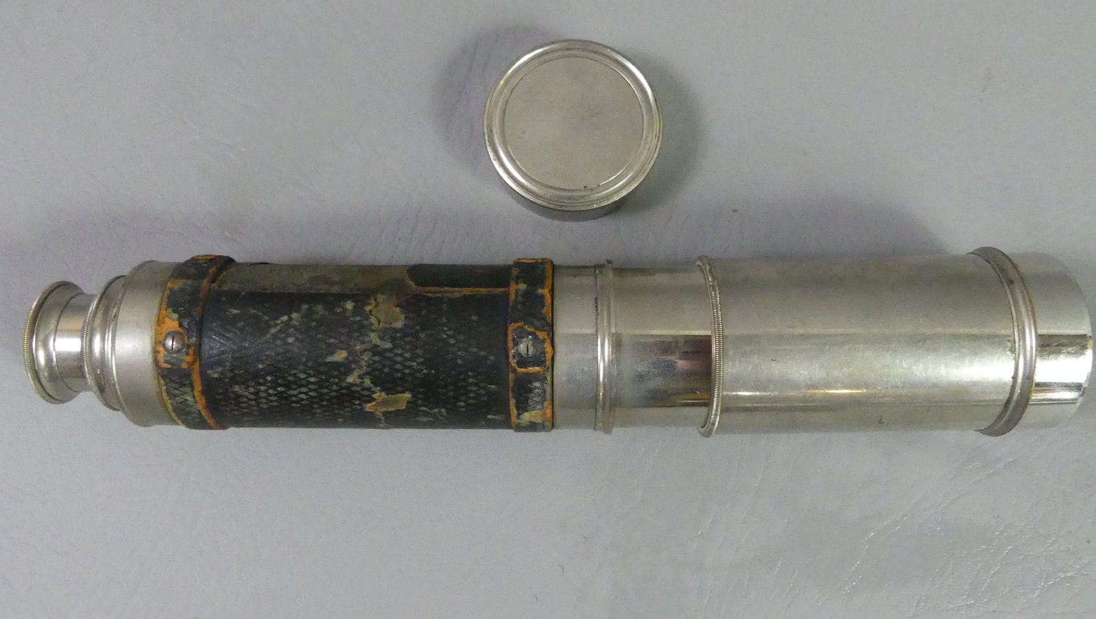 ANTIQUE FRENCH TELESCOPE: Antique nickel plated and leather wrapped telescope - opens from 10 to 23.5 inches. Signed Pedraglia Jeune Opticians de la Jeune a Nantes. Good optics