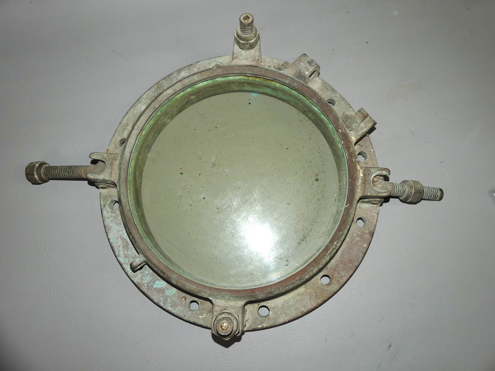 BRONZE SHIP PORTHOLE: Old solid bronze round ship porthole, 12 in window, 16 in overall. Good condition.
