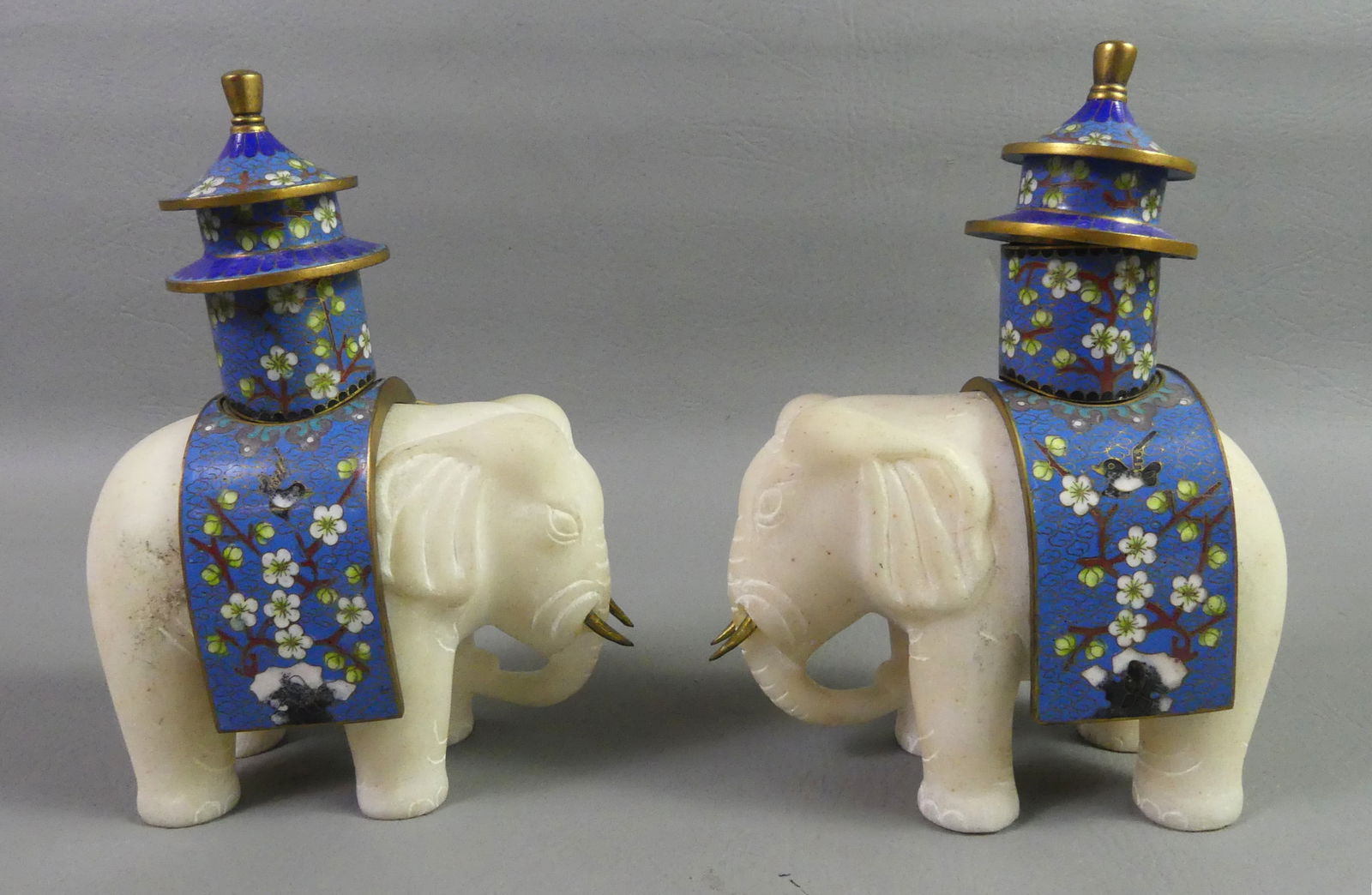PAIR CHINESE MARBLE ELEPHANT CANDLESTICKS: Pair of old Chinese white marble elephants with cloisonne mounts to hold a candlestick. The saddles easily come apart in sections. 7.5 in tall and 5.5 in wide. VG condition.