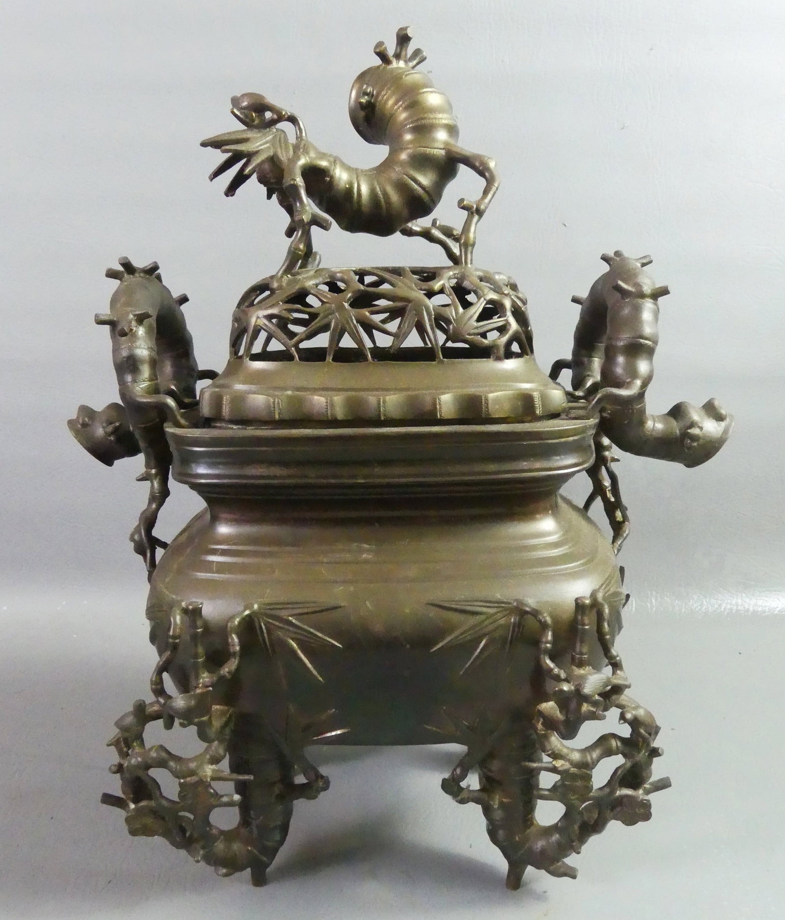 NGUYEN DYNASTY BRONZE CENSER: 19th century Vietnamese large bronze covered censer with elaborate bamboo designs and reticulated lid. Attr. Nguyen Dynasty circa 1880. 17 in tall x 12 in wide. VG condition.