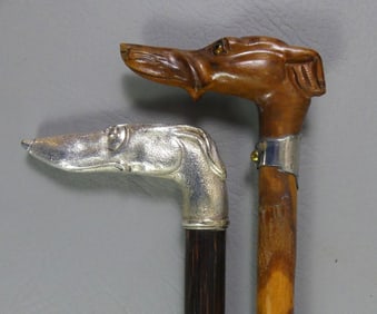 2 CARVED DOG HEAD CANES