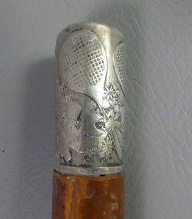TIFFANY STERLING TENNIS CANE: Stamped Tiffany & Co. sterling knob handled walking stick with 4 engraved tennis rackets and flowers. It has a cocabola shaft 49.5 in long. Handle 2.25 in long. Some small dings/scratches