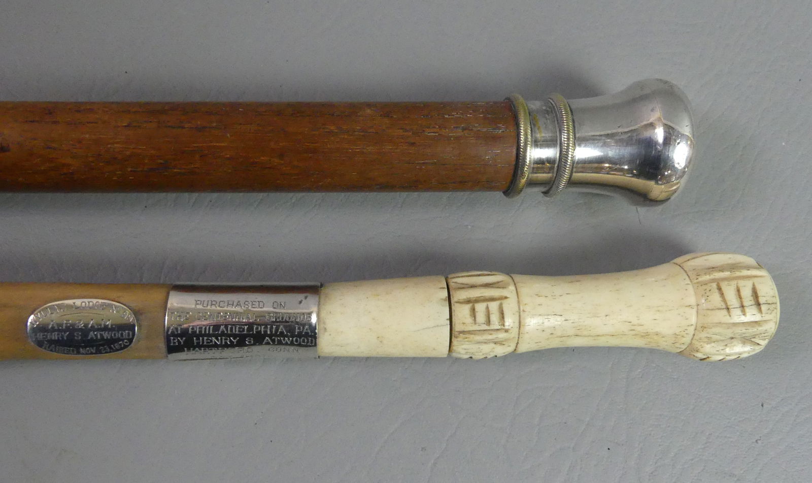 1870 WHALEBONE MASONIC & OAK CANE: Lot 2 canes or walking sticks: Carved whalebone handled knobby wood cane with nickle plated collars engraved PURCHASED AT CENTENNIAL GROUNDS AT PHILADELPHIA PA BY HENRY ATWOOD, HARTFORD CT. 1876 and W