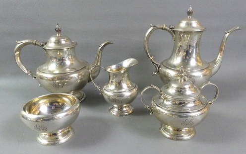REED & BARTON STERLING TEA SET - PILGRIM: A Reed and Barton sterling silver 5 piece tea set in The Pilgrim pattern #750 (monograms). Includes two pots to 10 in tall; covered sugar; waste bowl and creamer. Total 66.7 ozt.