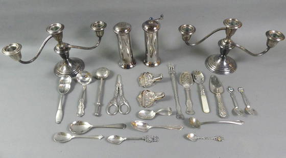 STERLING & SILVER PLATED LOT: Lot consisting of: pair weighted sterling convertible candlestick holders, 11 in wide x 6.25 in; Pair silver plated salt and pepper grinders; pair of silver plated grape shears; plated tea ball; and o