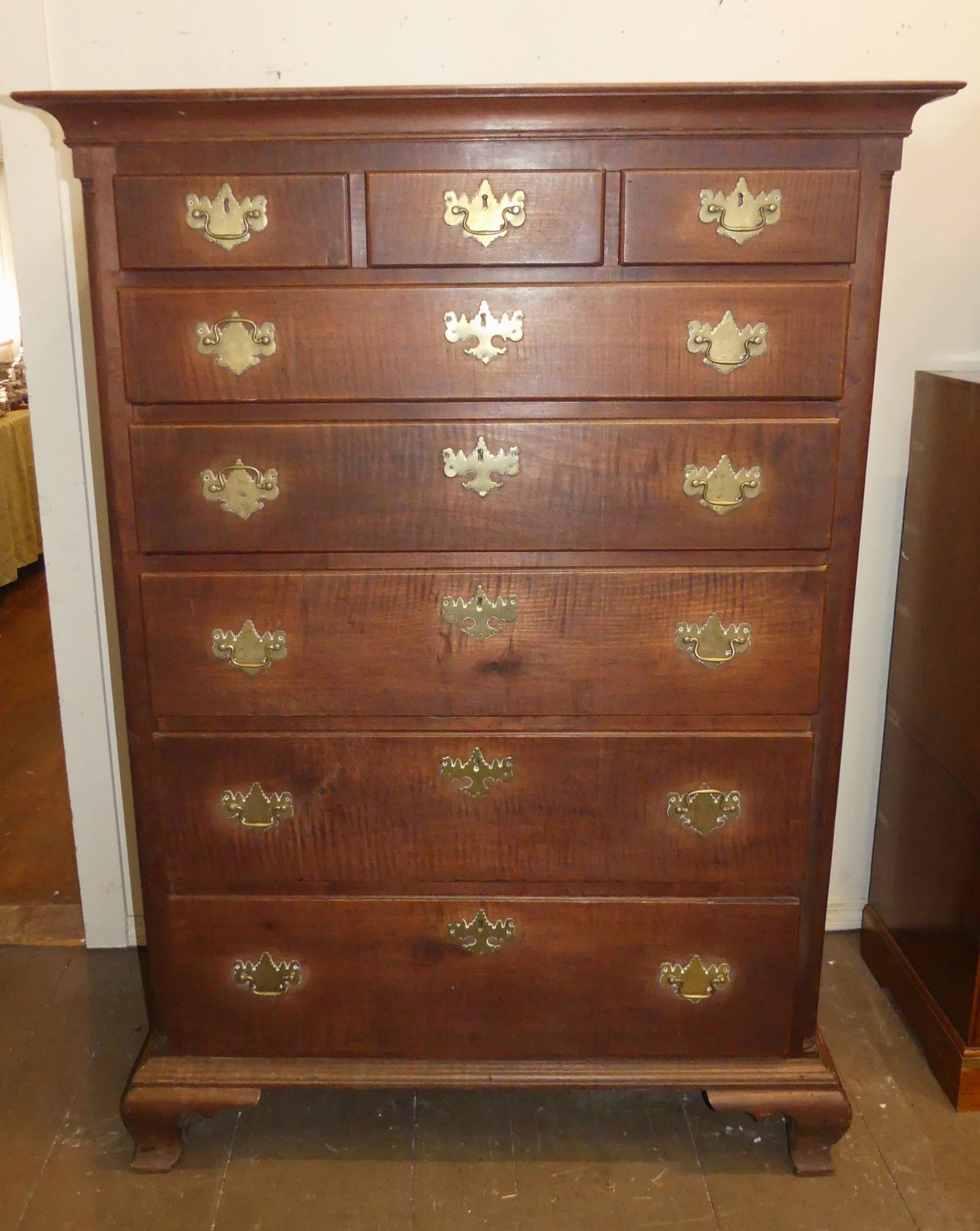 PERIOD TIGER MAPLE PENN. TALL CHEST: Large dark tiger maple 8 drawer tall chest with graduated drawers from Pennsylvania area. 62.5 in tall x 24 d x 45 wide. One sliver of molding missing on top right edge, contraction crack on side of c