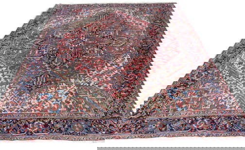 ANTIQUE HERIZ RUG 9 X 11 FT: Antique Heriz room size carpet with center medallion, 8 ft 10 x 1 ft. Good overall with minor scattered wear.