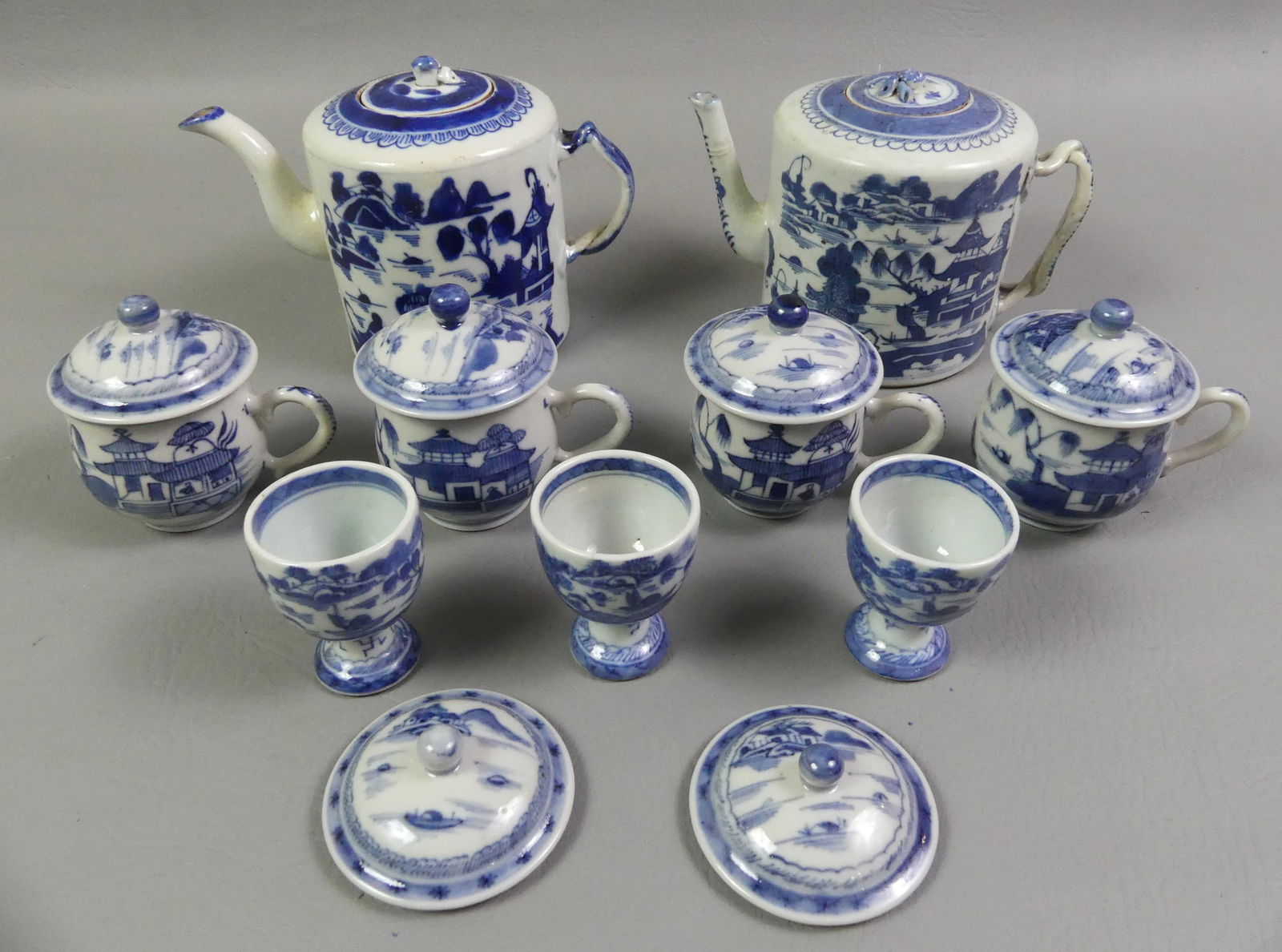 LOT ASSORTED CHINESE CANTON TABLEWARE: Lot assorted antique Chinese Canton ceramic items: 2 drum style teapots, 5 in high with lids (both excellent); 4 syllabub covered pudding cups, 3.5 in; 3 egg cups; and 2 syllabub covers (2 in interior