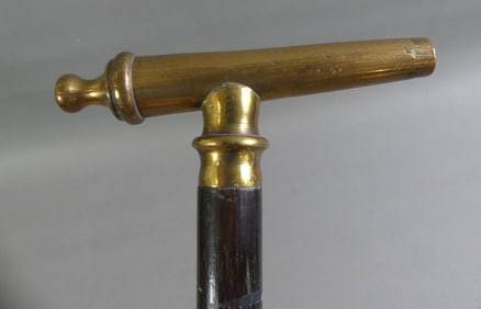 OLD BRASS CANNON CANE