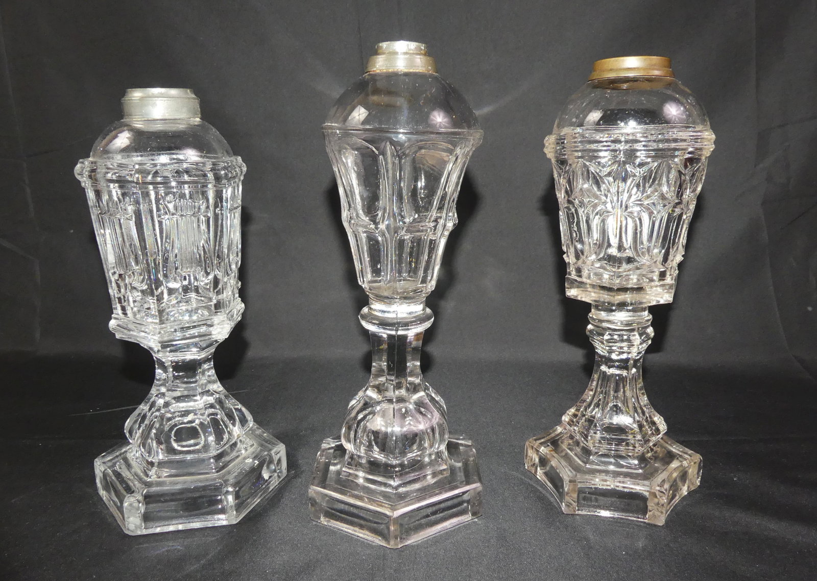 3 SANDWICH WHALE OIL LAMPS: Lot of 3 Sandwich Glass whale oil lamps to 10.5 in tall, all have hexagonal bases and various designs including Lyre. All VG condition - Star has minor chips on base.