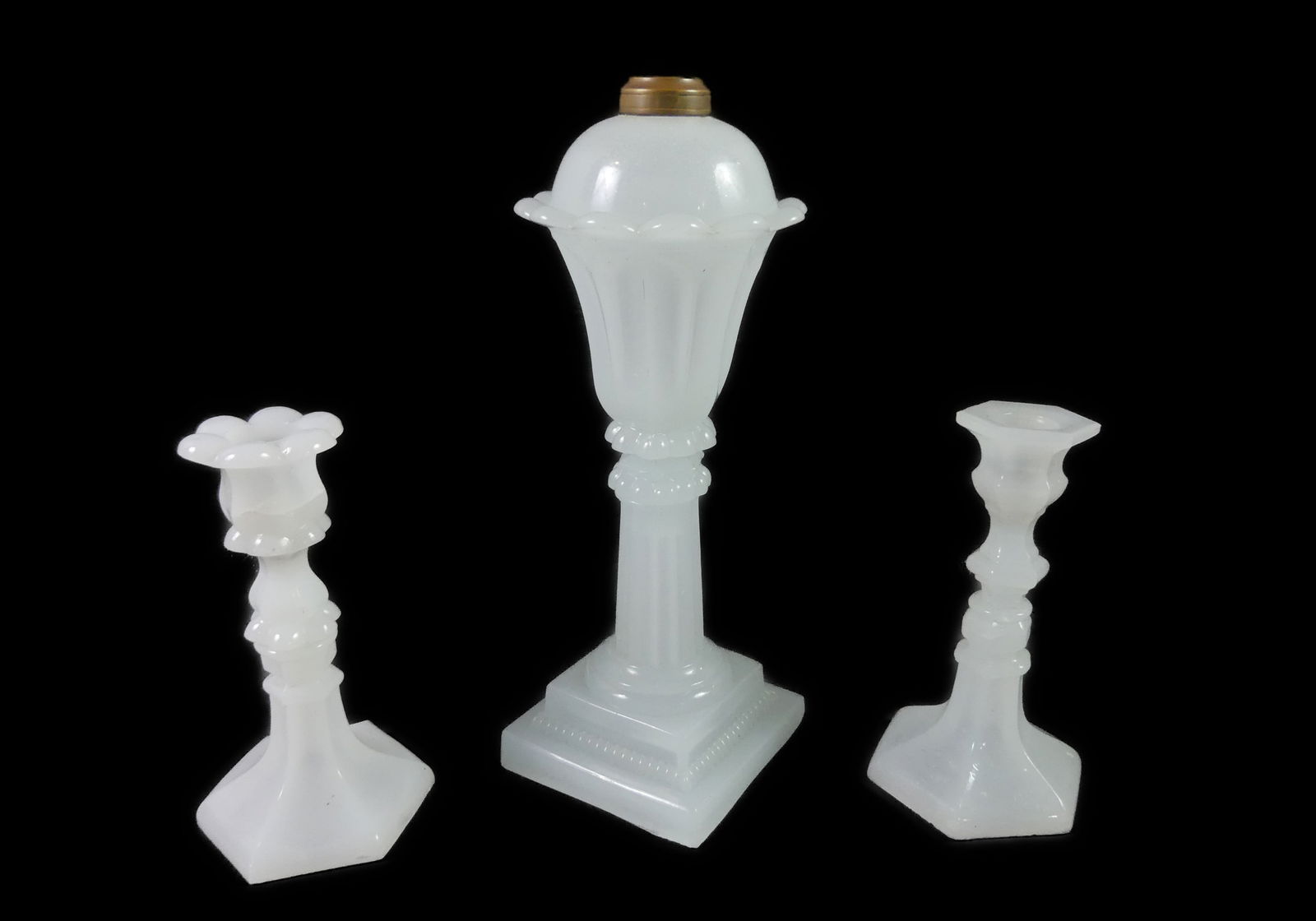 CLAMBROTH SANDWICH LAMP & CANDLESTICKS: 2 Sandwich Glass lighting objects: 12 in clambroth oil lamp (base is ground on one side); and pair of clambroth candlestick holders, 7 in tall (some internal cracks).