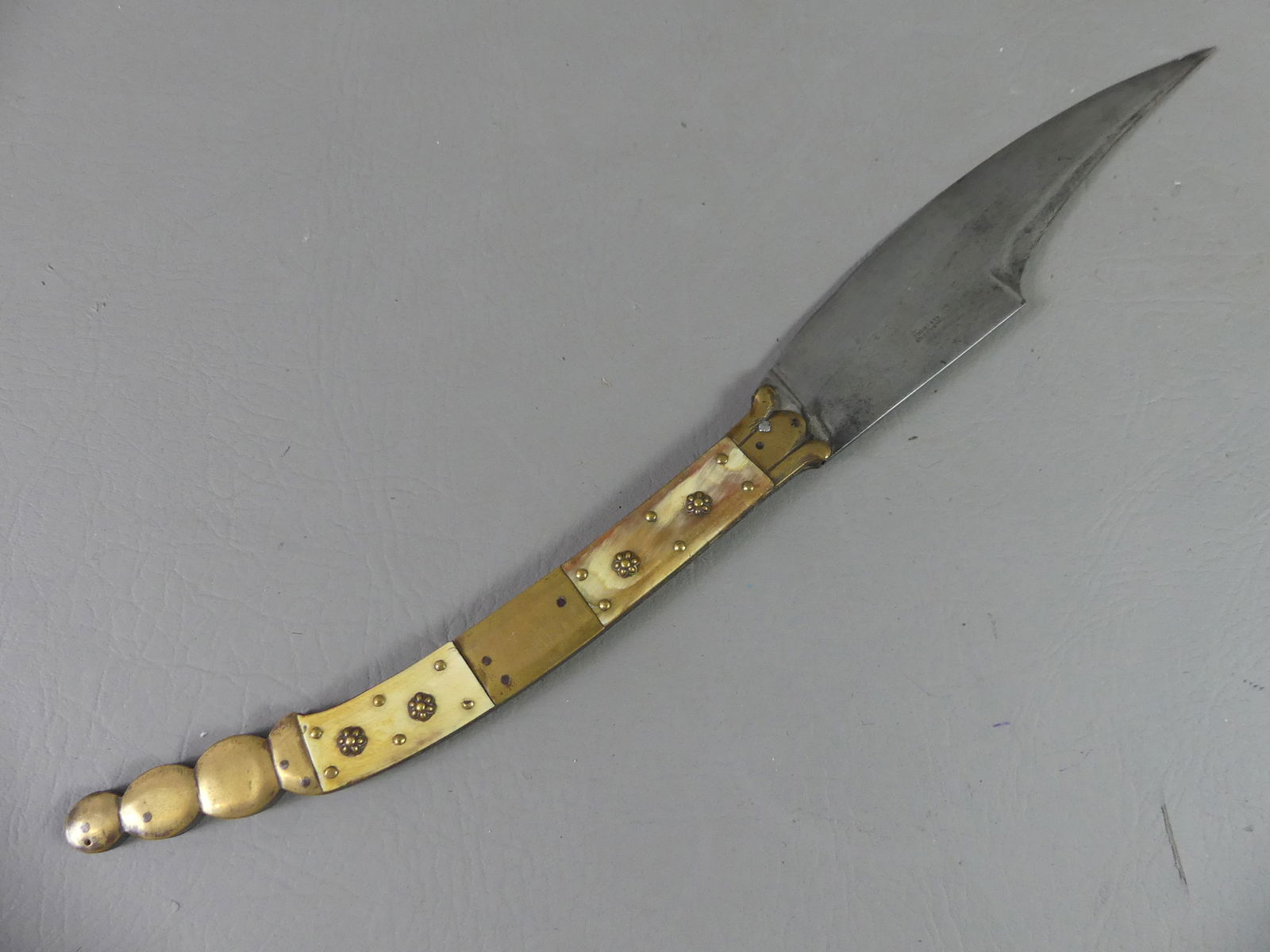 SPANISH NAVAJA KNIFE - ARAGOZA: 19th century brass and bone handled Spanish folding knife or Navaja stamped by maker Valero Jun Zaragoza. 17 in long, blade is 8 in.