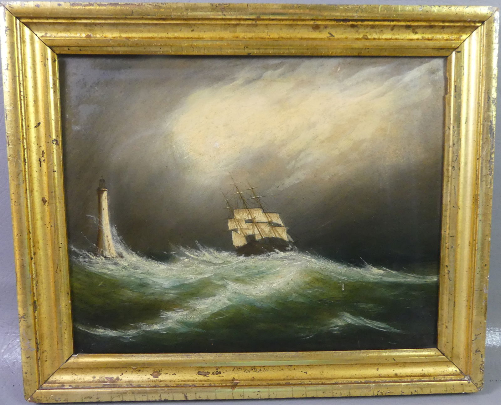 CLEMENT DREW SHIP IN STORM PAINTING: 19th century oil painting on board of a ship at night in storm near a lighthouse (probably Minot's Light). Hand signed lightly on back Clement Drew. 10.75 x 13.25 in, framed 13 x 16 in. (Clement Drew