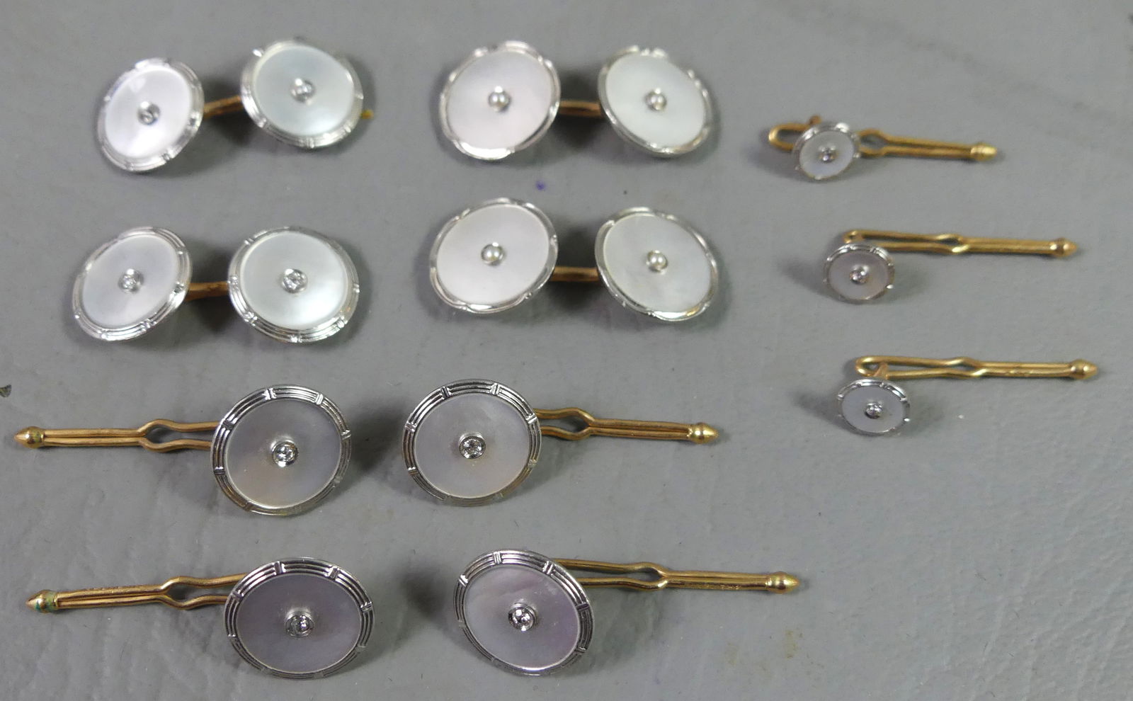 14K GOLD BUTTONS & CUFFLINKS LOT: Lot 14k gold buttons and cufflinks lot with tiny diamond in center and abalone disk, to 1/2 inch. Total 16.7 dwt. NOTE: We can ship this item in-house
