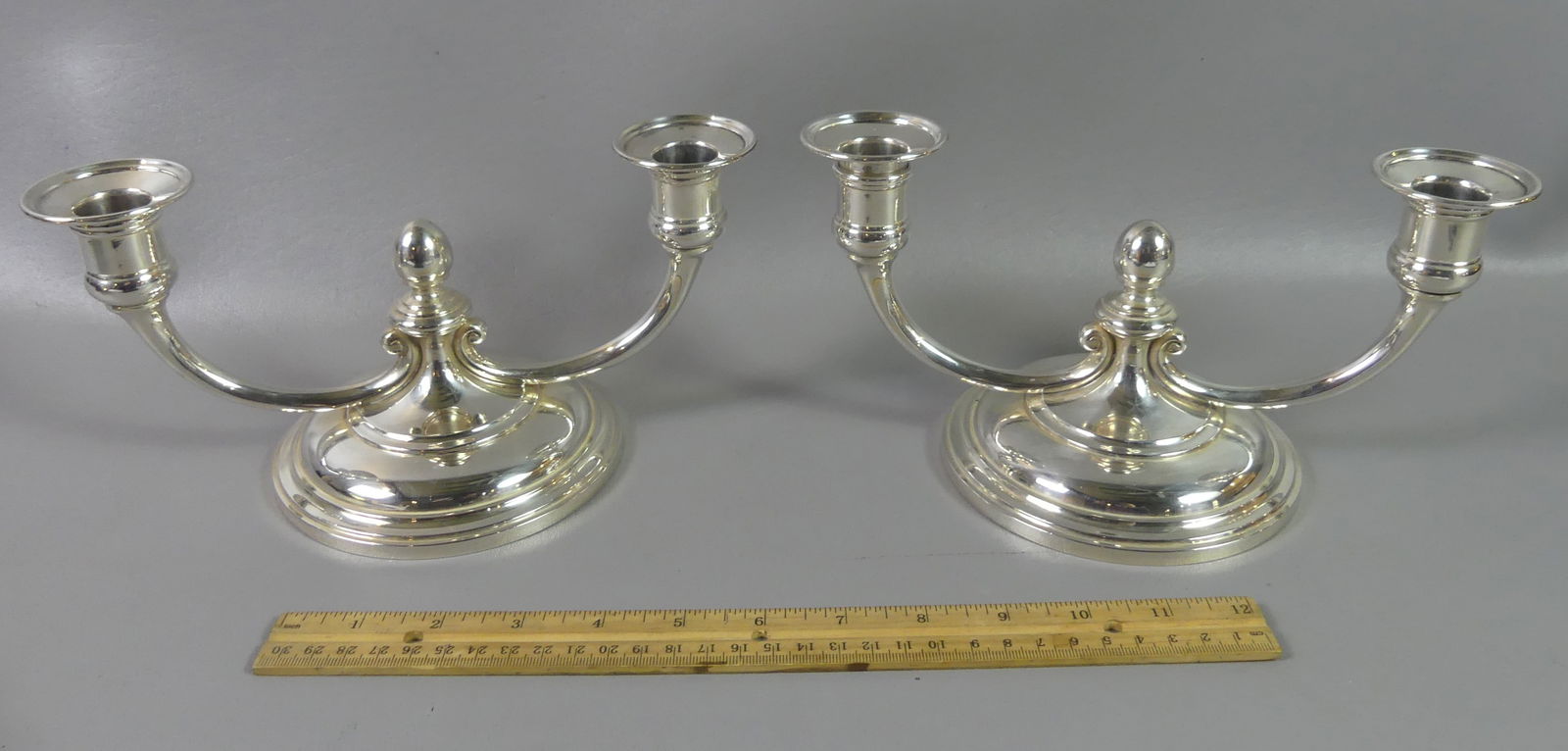 PR. TIFFANY STERLING CANDLE HOLDERS: Pair of solid sterling silver double candlestick holders signed Tiffany & Co Makers 21337M. They are 9.5 in wide and 4.75 in high, total weight (NOT weighted) 34.4 ozt. Fine condition, no monograms. N