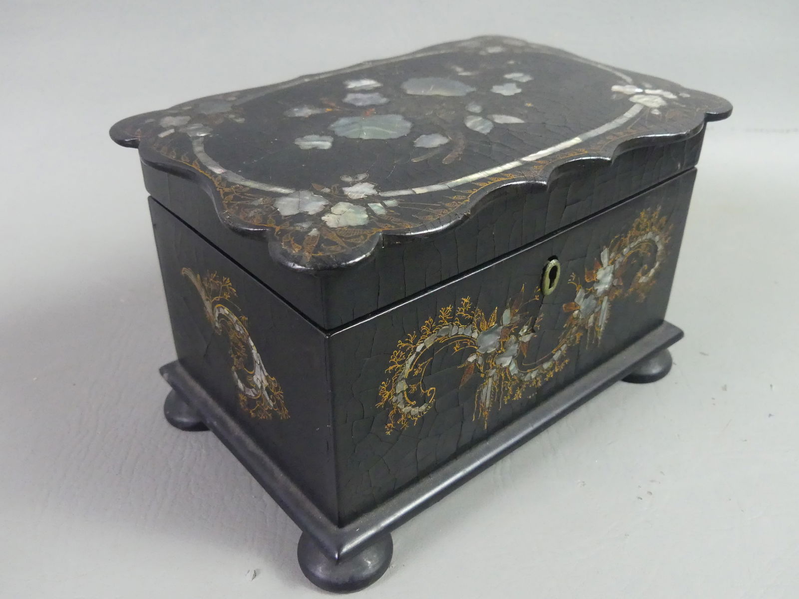 PAPER MACHIER DOUBLE TEA CADDY: 19th century paper machier double tea caddy box with abalone inlay and gilding. 7.5 x 5 x 5 inches. NOTE: We can ship this item in-house