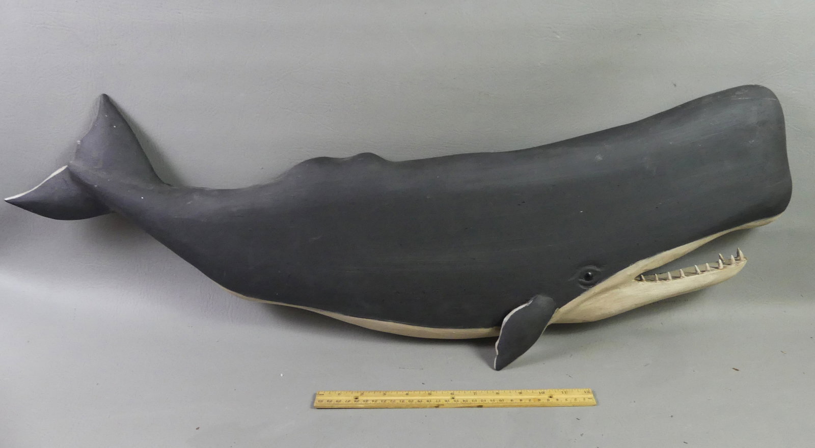 BECKENHAUPT 3 FT. WHALE PLAQUE: Carved and painted wood plaque of a sperm whale signed Ken Beckenhaupt, Cape Cod. 37 in long and 10 in high. NOTE: We can ship this item in-house