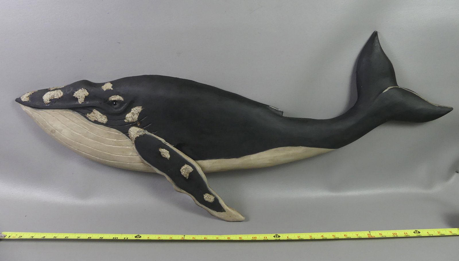 BECKENHAUPT HUMPBACK WHALE PLAQUE: Carved and painted wood Humpback whale plaque signed Ken Beckenhaupt, Cape Cod. 41 in long x 12 in high. NOTE: We can ship this item in-house