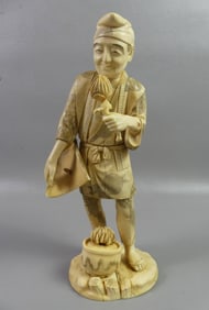 JAPANESE CARVED BONE FLOWER SELLER
