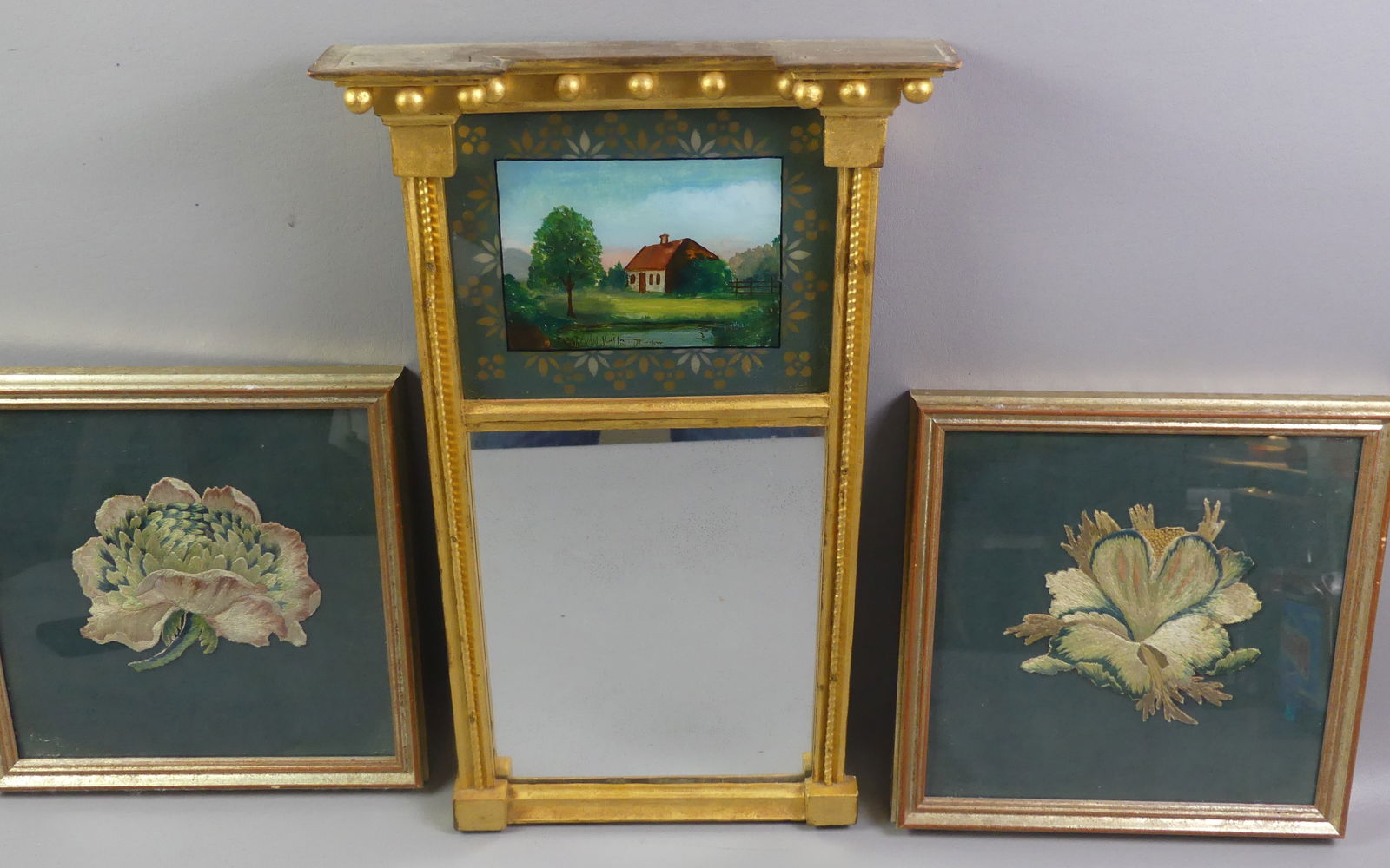 PR. CREWELL WORK FLOWERS & MIRROR: Lot consisting of a Federal period gilt wall mirror with eglomise painted upper tablet of a cottage, 20 x 11 inches; and pair of 19th century framed crewell work cut-outs of flowers, 11 x 11 in