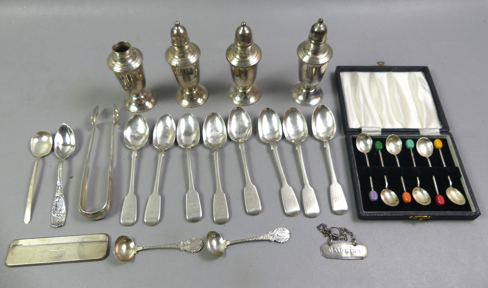 LOT ASSORTED STERLING ITEMS: Lot miscellaneous sterling items: 4 weighted salt pepper shakers (one cover missing); set 6 boxed demitasse spoons with bakelite finials, London CB&S, 3.5 in; 8 antique teaspoons, Dublin JS; pair