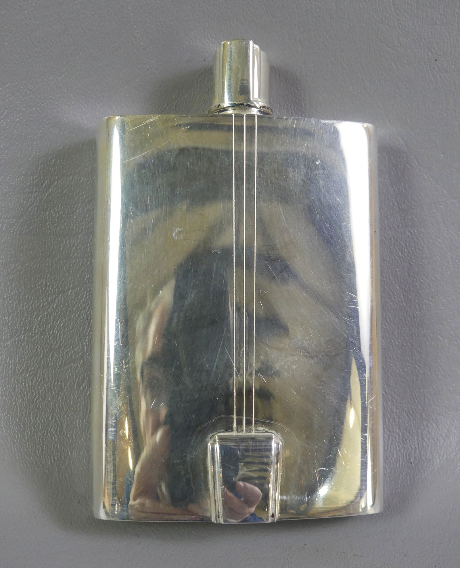 TIFFANY & CO. STERLING FLASK: Signed Tiffany & Co. Italy 2003 sterling silver flask in an Art Deco design. 5 x 3 inches, weighs 5.82 ozt. NOTE: We can ship this item in-house.