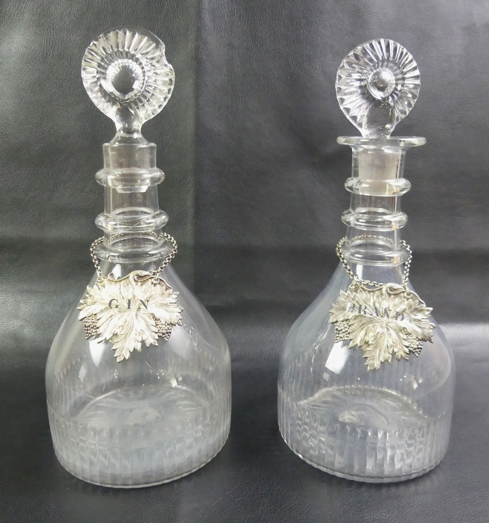 PAIR IRISH DECANTERS - CORK GLASS C. 1800: Pair of rare Irish blown and cut glass decanters with triple-ringed necks and circular stoppers, each signed CORK GLASS CO. on underside (1782-1818). One in perfect condition, one has ground lip and