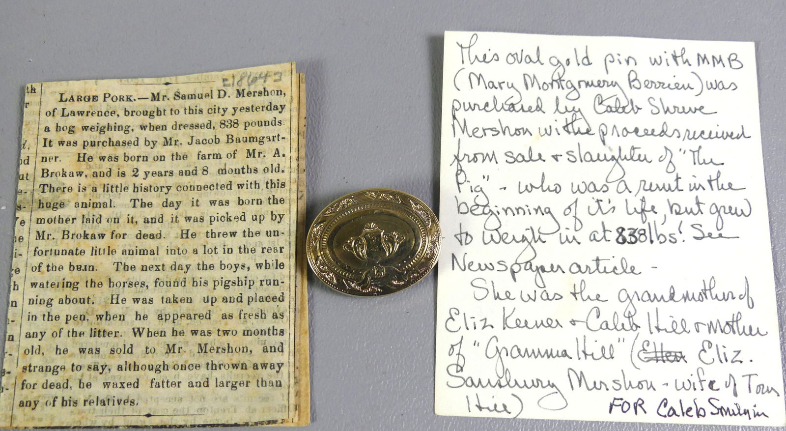 GOLD ENGRAVED VICTORIAN BROOCH: Victorian 12-14k gold oval brooch engraved MMB (Mary Montgomery Berrieu). Comes with newspaper article from 1864 stating that the brooch was purchased with the proceeds of the sale of an 838 lb. pig