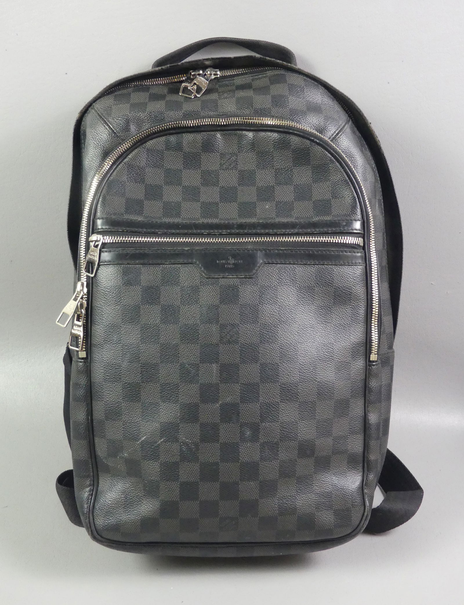 LOUIS VUITTON BACKPACK - DAMIER: Vintage Louis Vuitton Damier (checkered) backpack in graphite color. Guaranteed authentic. Good condition. NOTE: We can ship this item in-house. Size: