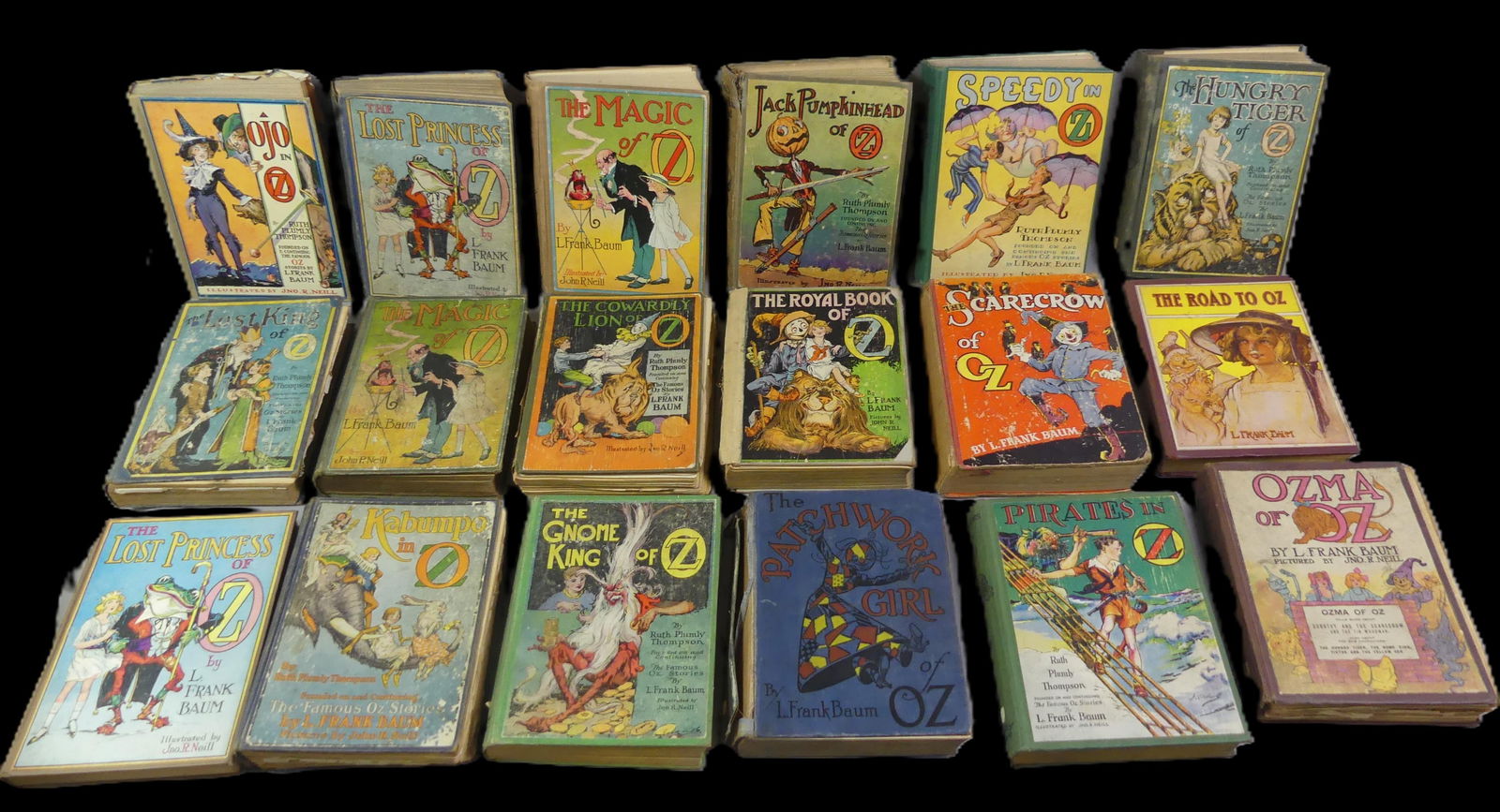 18 ANTIQUE OZ BOOKS - L. FRANK BAUM: Lot of 18 antique hardcover books from the Oz series (made famous by the Wizard of Oz) by L. Frank Baum, most from 1915-30's. Various conditions. NOTE: We can ship this item in-house.