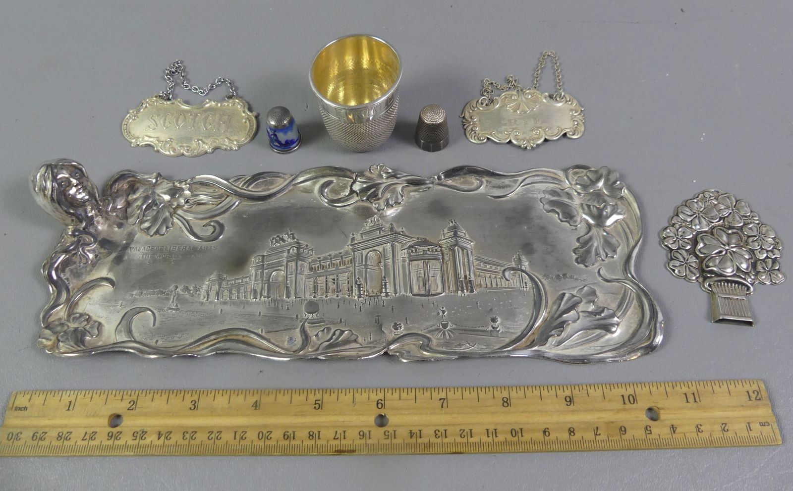 STERLING SILVER LOT INCL. THIMBLES: Lot of assorted mostly sterling items: 1.75 in thimble-form shot cup; Scotch and Rye liquor bottle tags; Gorham floral whistle; Reed and Barton "Good Luck" 2.75 in; and 2 thimbles (all previous .925