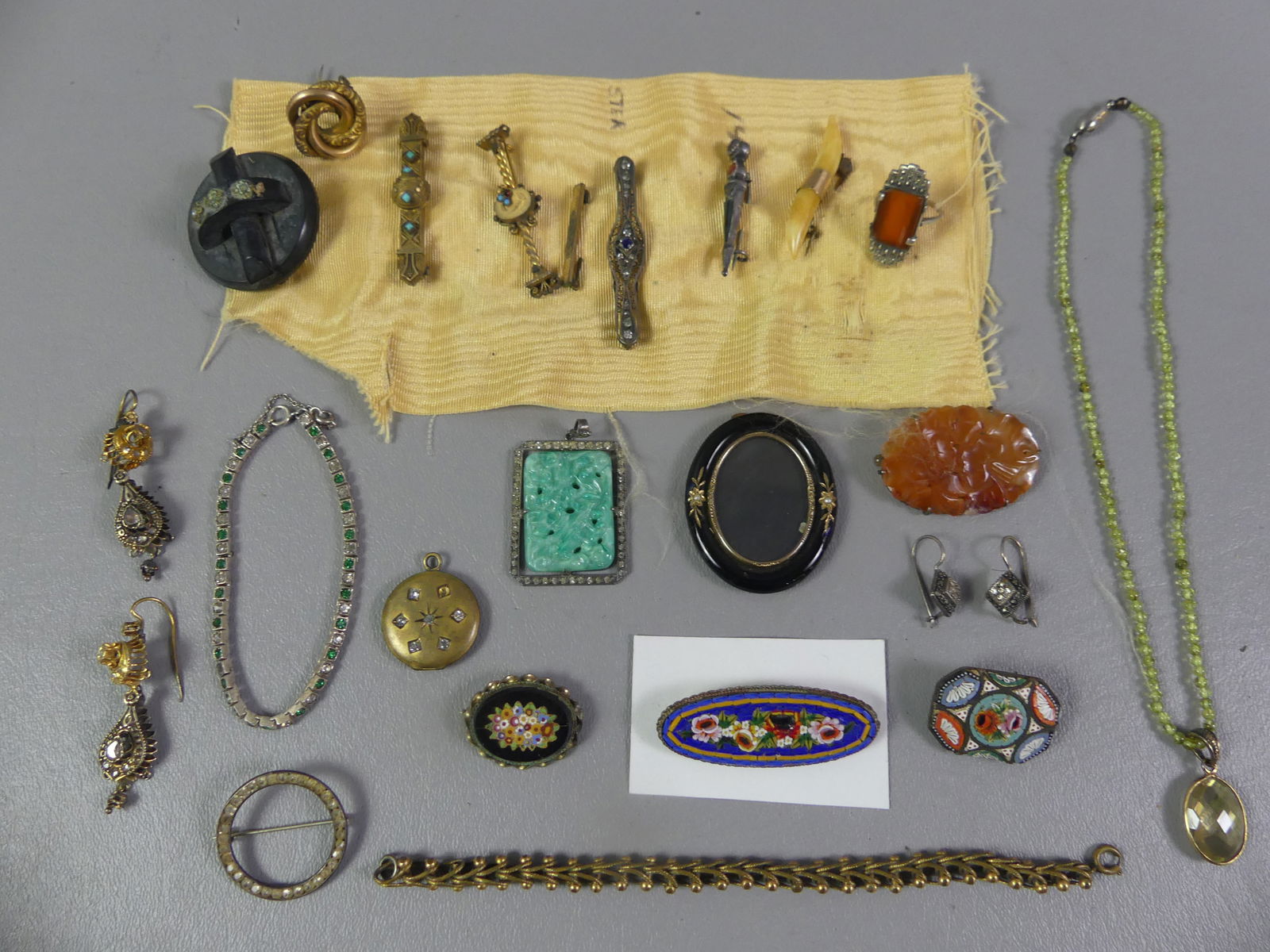 LOT MOSTLY VICTORIAN JEWELRY: Lot of mostly Victorian jewelry: 3 Italian micromosaic brooches to 2 in long; fancy earrings, bracelets, 1.5 in jadeite pendant; carnelian carved brooch, peridot bead necklace, etc. About 22 pieces.