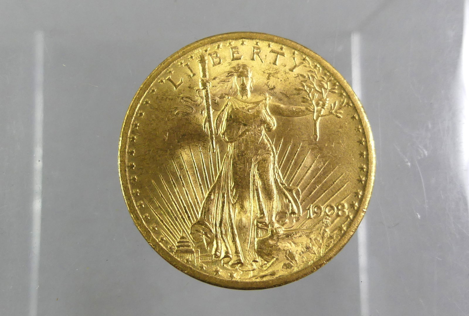1908 $20 GOLD COIN: 1908 $20 St. Gaudens Double Eagle gold coin (no motto), ungraded but appears to be About Uncirculated. NOTE: We can ship this item in-house.