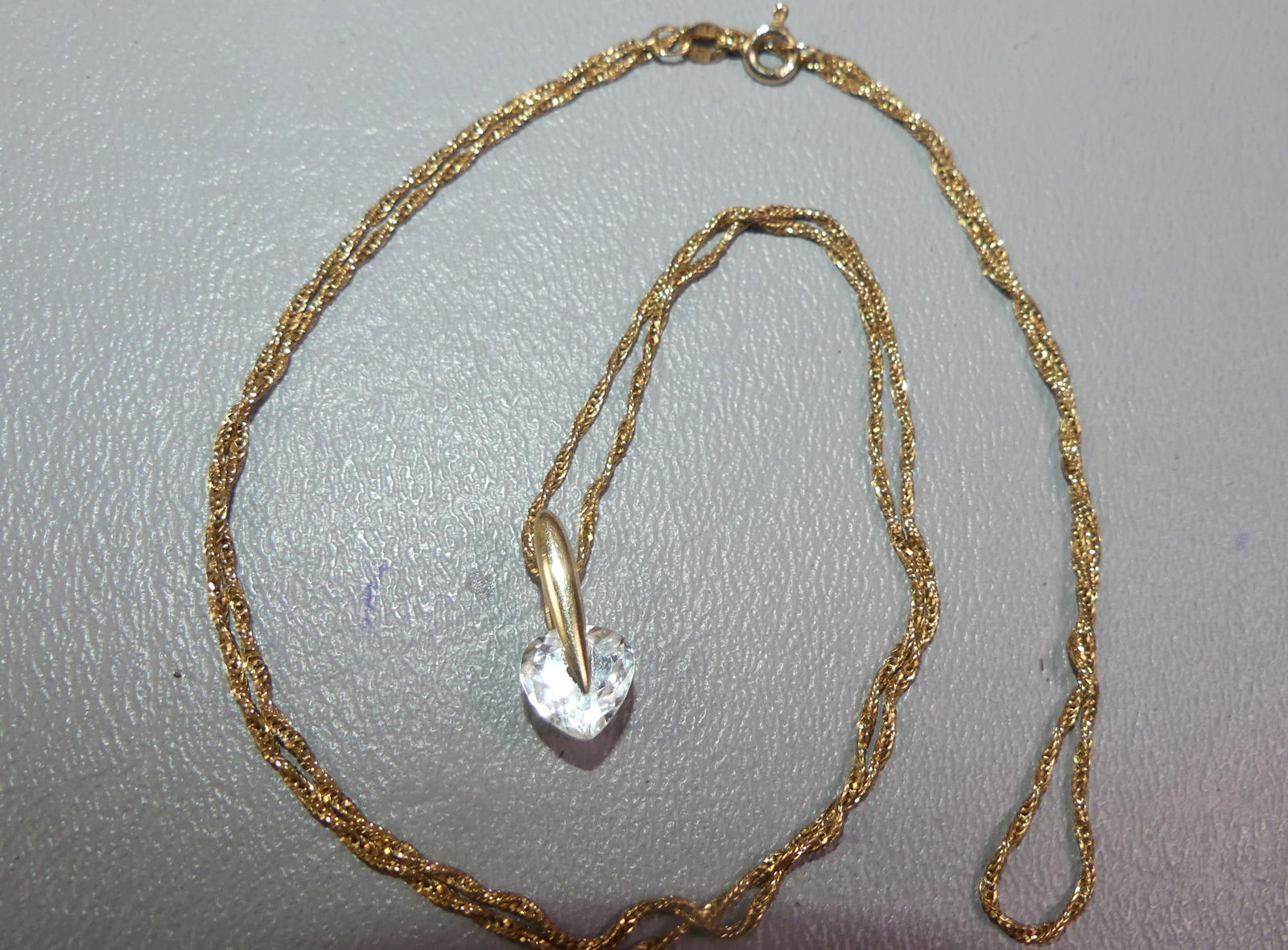 1/2 CT. DIAMOND & 14K GOLD NECKLACE: Approximately 1/2 carat heart-shaped diamond pendant with 14k gold necklace, 24 in long. Pendant stamped 14k and BH, necklace stamped 14k Italy and Affie(?). 2.80 dwt. NOTE: We can ship this item
