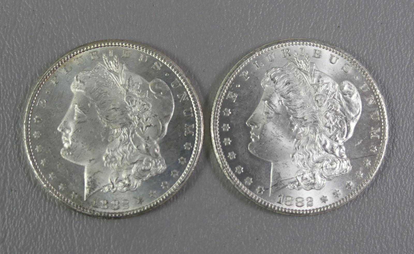 2 MORGAN SILVER DOLLARS 1882-CC (1 of 2)