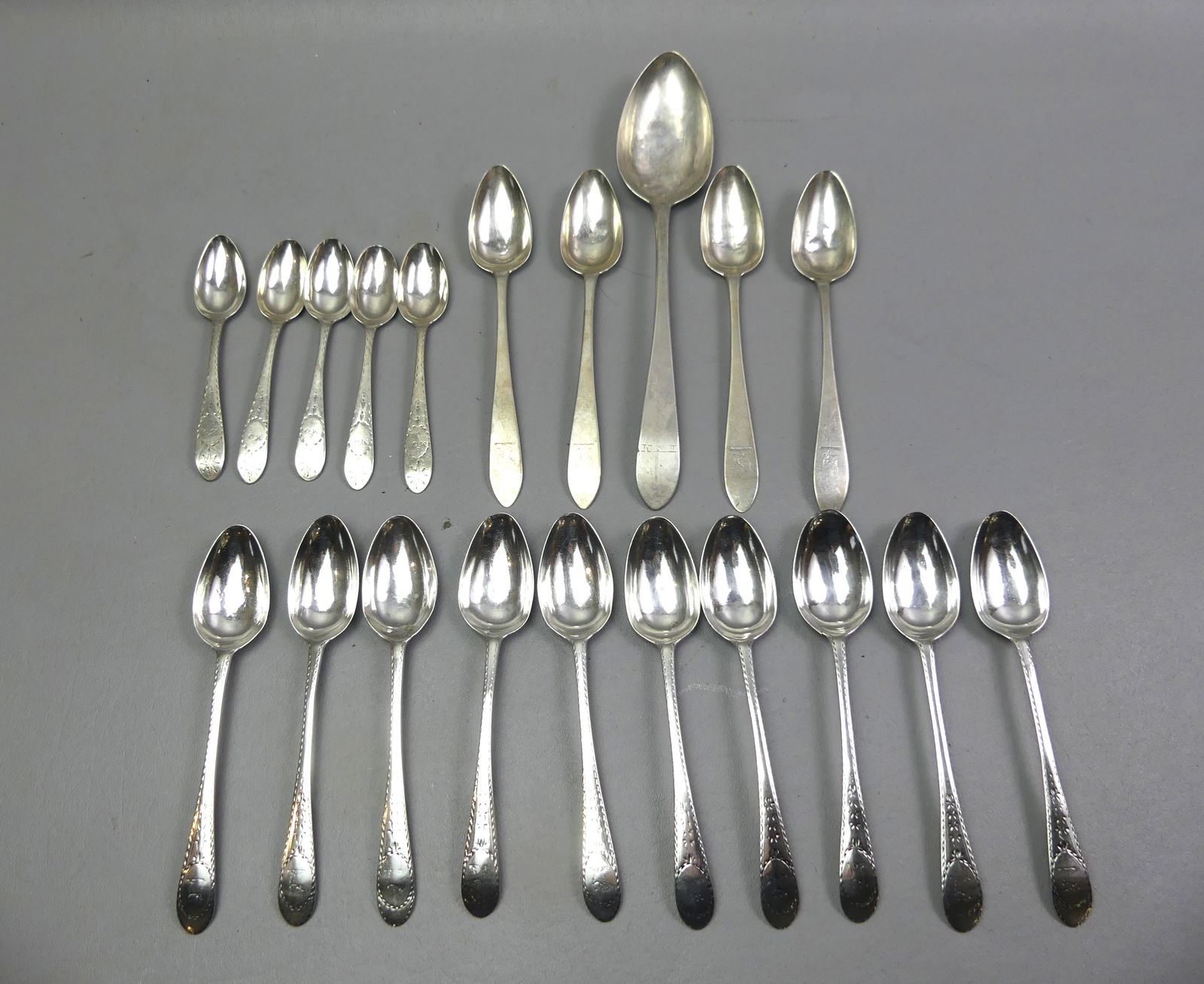3 SETS ANTIQUE STERLING SPOONS: 3 sets of sterling silver spoons to 7 in long pluss large serving spoon (10 in). One set stamped Gibson, one SR, one WR. 20 pieces, 17 ozt. Total. NOTE: We can ship this item in-house.
