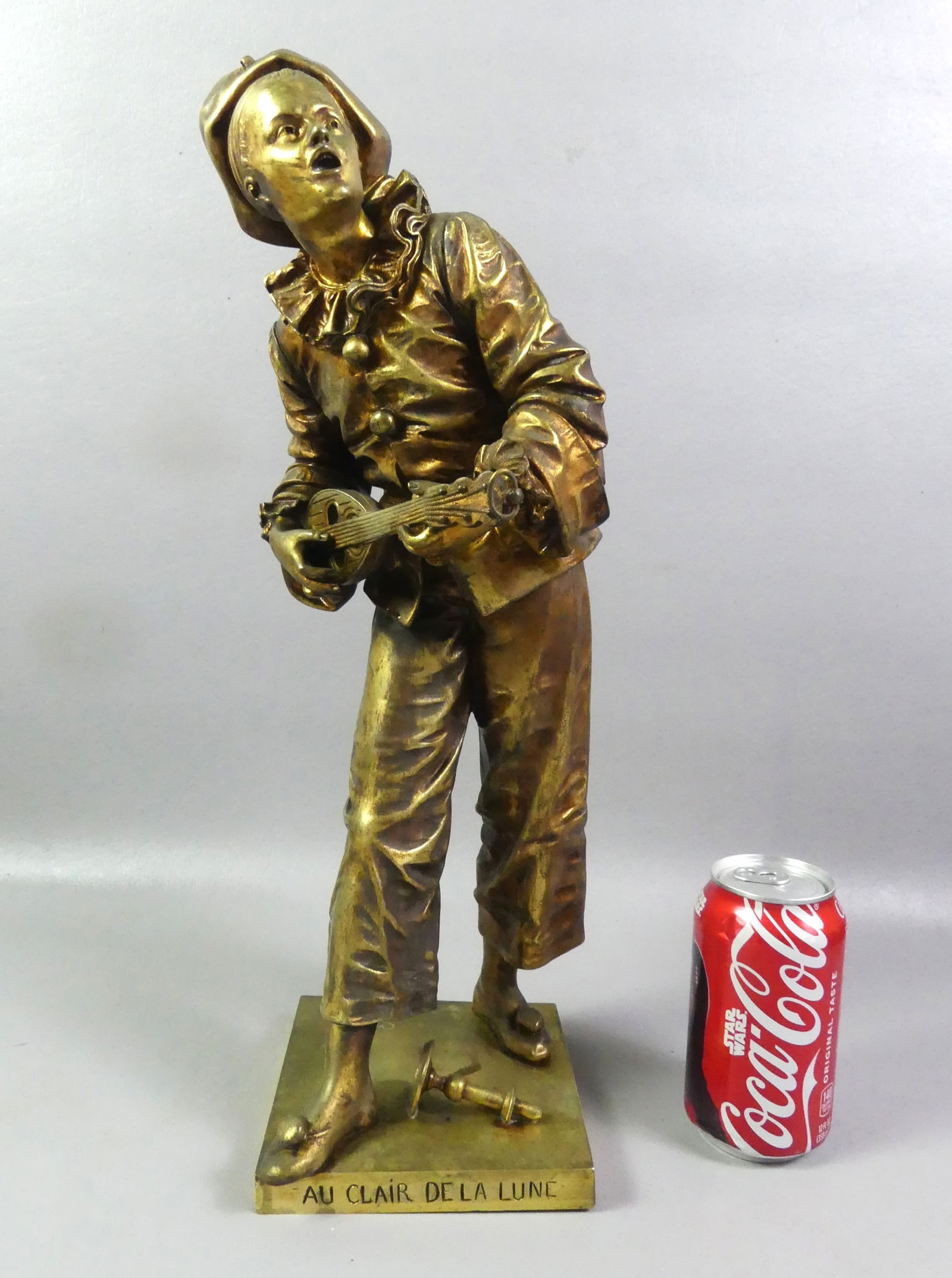 ANTIQUE FRENCH BRONZE - JESTER SIGNED BOURET: 19th century French gilt bronze figure of a jester (known as Pierrot) signed BOURET and titled AU CLAIR DE LA LUNE (By the Light of the Moon, a popular 18th c. French song). Size: 18 in tall, base