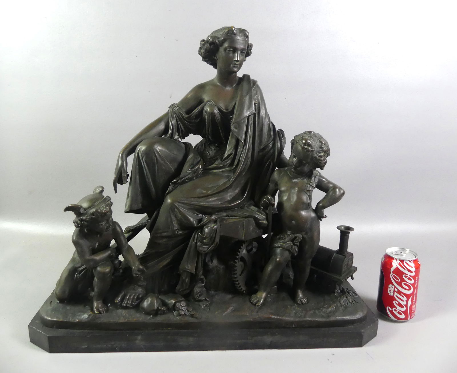LARGE ANTIQUE FRENCH BRONZE GROUP: Large antique French classical bronze group depicting a classical woman and two children with toy wagon, bag of coins, etc. No visible signature, circa 1880. Size: 20 x 22 x 8 inches, weighs about 85