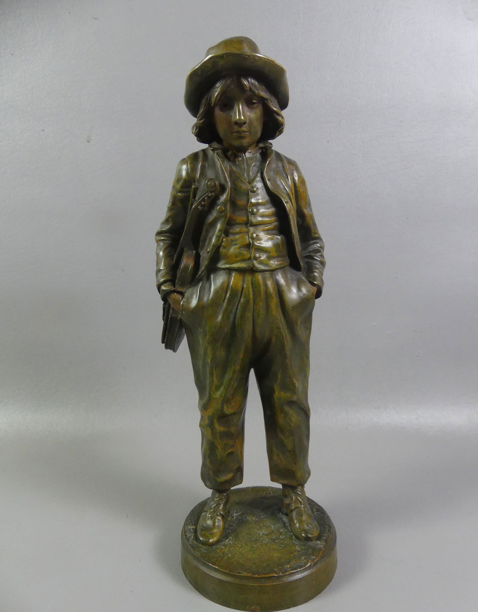 BRONZE VIOLINIST SIGNED J. GARNIER: 19th century French bronze sculpture of a young violinist signed J. GARNIER with L.V. reduction stamp. 16 in tall. Good condition. (Jean Garnier, French 1820-1895). NOTE: We can ship this item