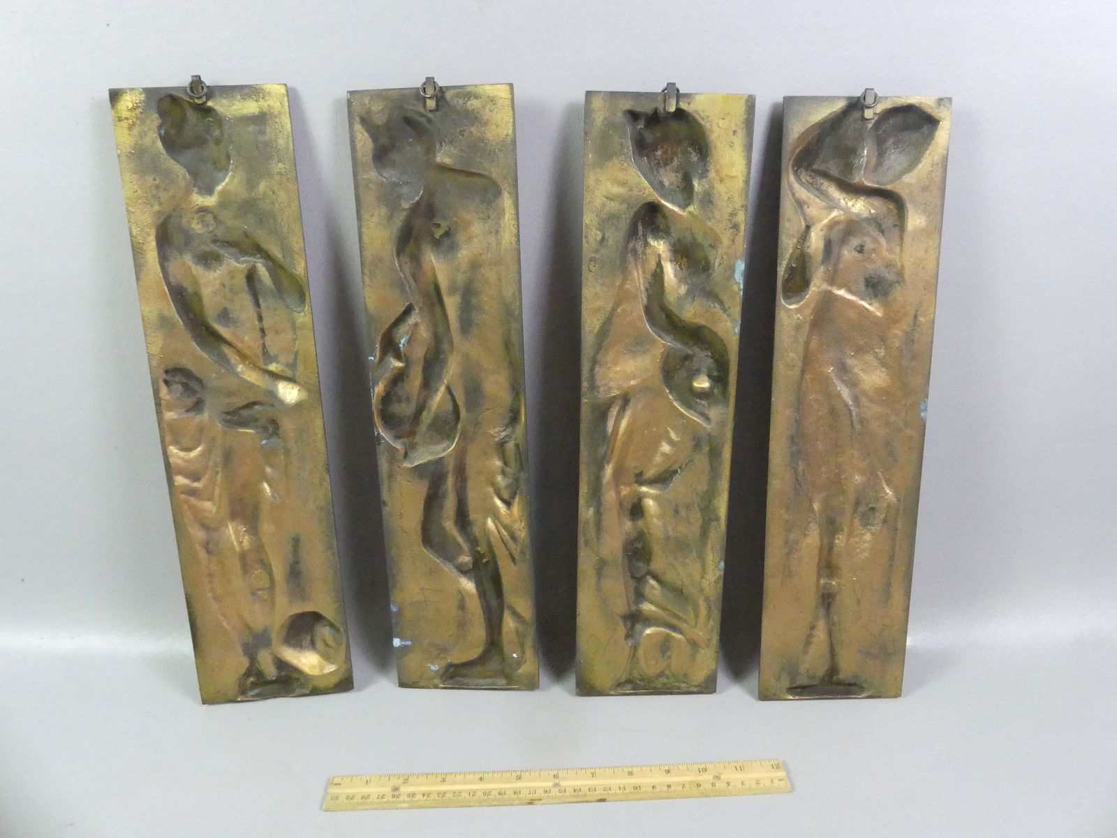 SET 4 BRONZE CLASSICAL PLAQUES: Set of 4 Victorian gilt bronze wall plaques with classical female figures. Stamped EA in lower corner. 17 in high x 4.5 in wide. Some scattered light oxidation/staining. NOTE: We can ship this item