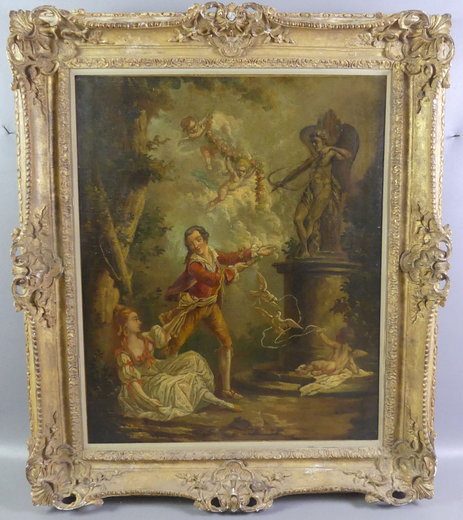 ANTIQUE FRENCH PAINTING - COURTING COUPLE: 19th century French classical oil painting on canvas of a courting couple in landscape with statue of Cupid, cherubs, and doves surrounding them. No visible signature. 29 x 24 in, framed 37 x 32 in.
