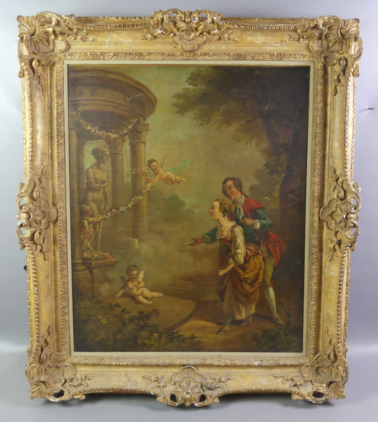 ANTIQUE FRENCH PAINTING - DRAWING ROOM SCENE: 19th century French classical oil painting on canvas of a courting couple in landscape with a statue of Venus under a gazebo, cherubs holding garlands, etc. No visible signature. 29 x 24 in, framed