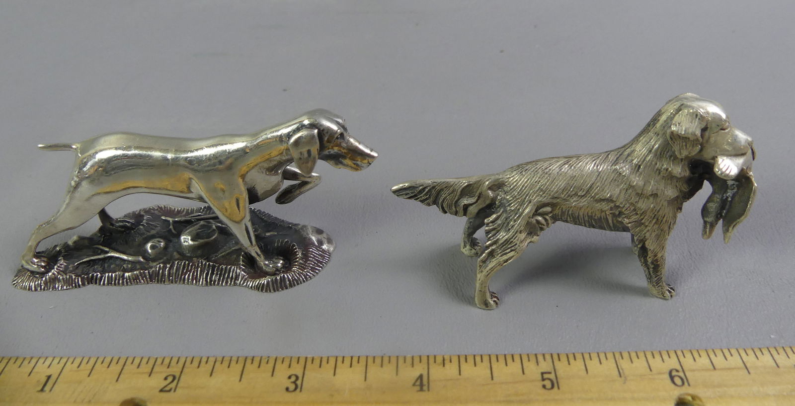 2 KIRK STERLING MINI DOG FIGURES: 2 vintage miniature sterling silver figurines of dogs by S. Kirk & Son from their ANIMAL SPIRITS collection. A Golden Retriever with bird in mouth, 3 x 1.75 inches, catalog #1547; and German