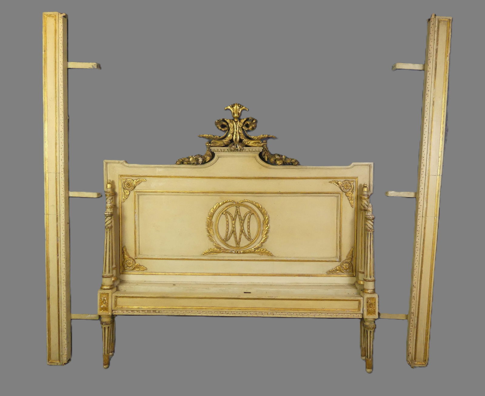 ANTIQUE FRENCH PAINTED DOUBLE BED: Antique French painted and gilt double bed with carved headboard. 59 in high x 62 w - rails are 77 in long. Good condition overall. Circa 1900 or earlier.