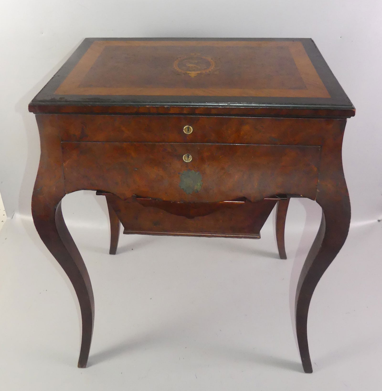 ANTIQUE INLAID SEWING TABLE: Antique inlaid sewing table with 2 drawers and lift top having maple fitted interior and mirror. Lid is nicely inlaid with birds and banding. Plate glass protective top. 30 in high x 24 x 17 in.