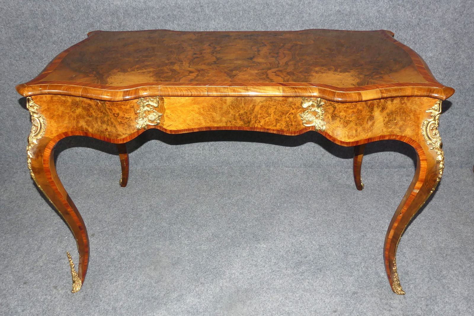 FRENCH ORMOLU INLAID DESK: Old French Louis XV style one drawer desk with ormolu mounts. Banded inlay. 44 x 24 x 28 in high. Good condition.