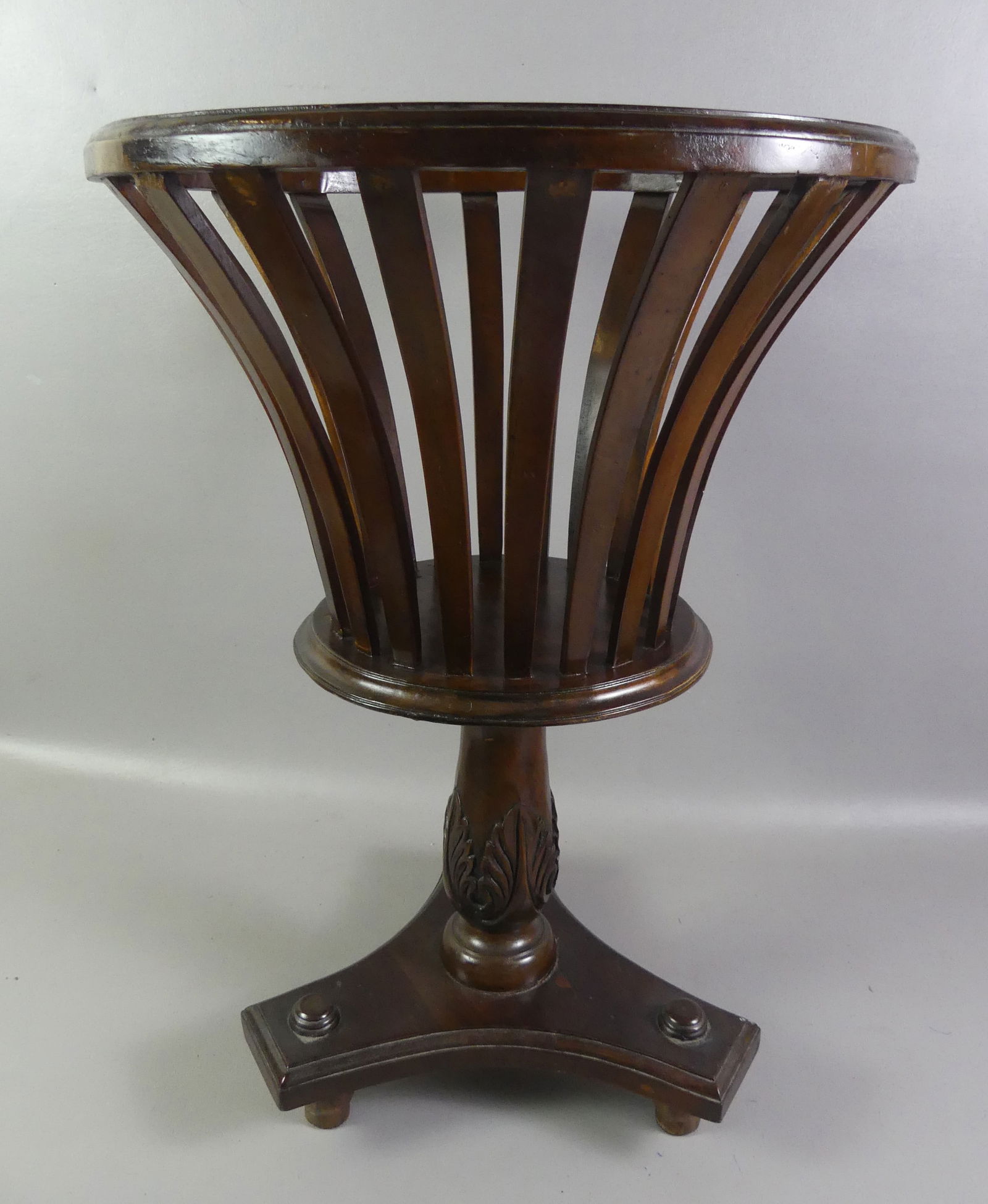 MAHOGANY FERNERY STAND: Custom mahogany fernery with flared openwork slats, carved base. 28 in high x 19 diameter.