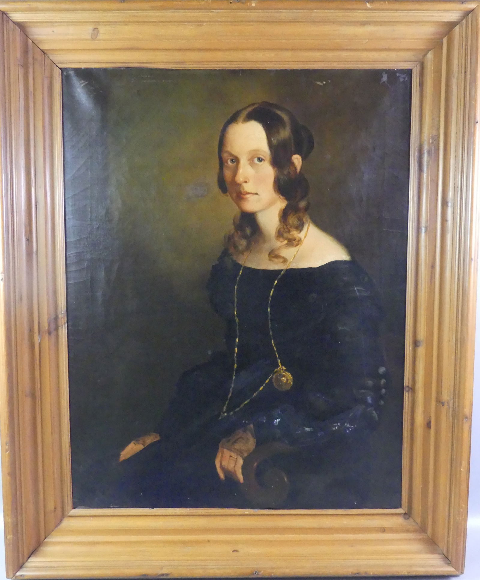 ANTIQUE PORTRAIT - YOUNG WOMAN: 19th century English oil on canvas depicting a seated young woman with black dress and long necklace watch. Unsigned, back of canvas has London label. 36 x 28 in, framed 46 x 38. Has few spots of