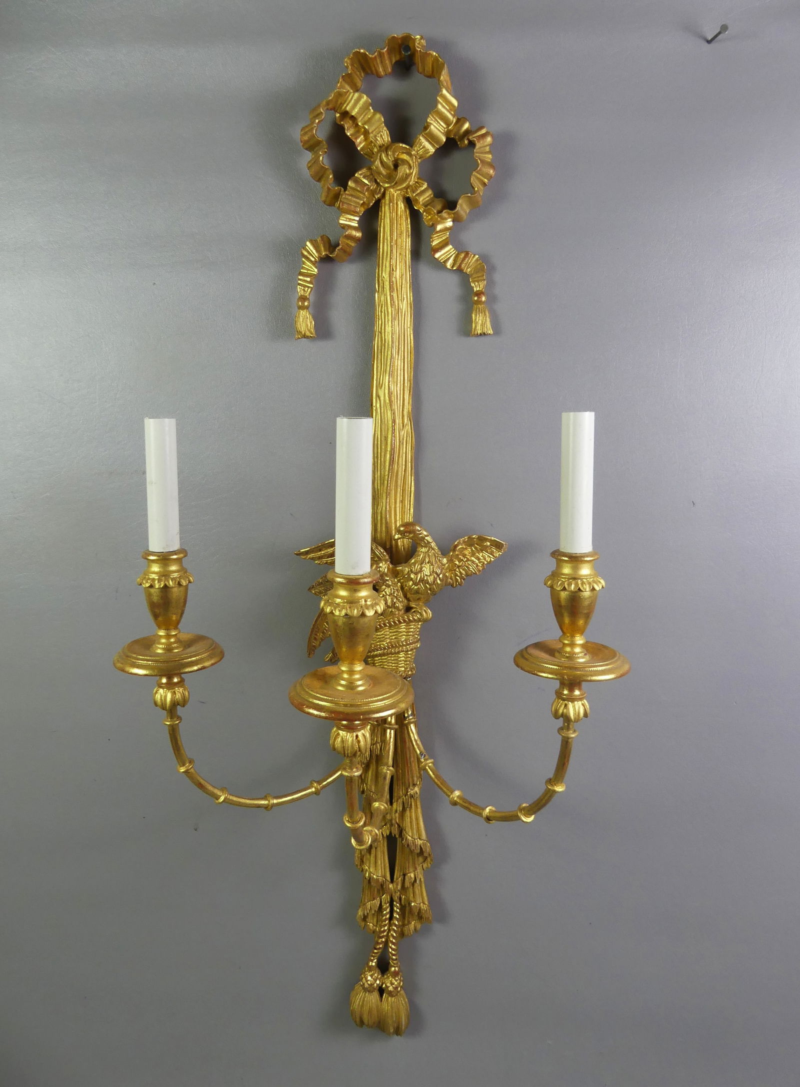 GILTWOOD TRIPLE WALL SCONCE: Fine vintage giltwood triple light, electric wall sconce with carved eagles in basket. 3 ft tall and 15 in wide. NOTE: We can ship this item in-house.